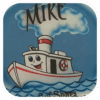 The Tuggin' Along Airbrushed Tee is an original design featuring a red & white cartoon boat on the water with steam coming from the top against a blue background.